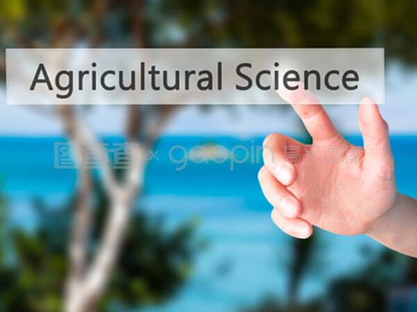 农业科学——手按下模糊背板上的按钮